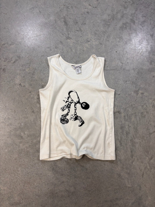 White baby onesie with black graphics on a gray surface